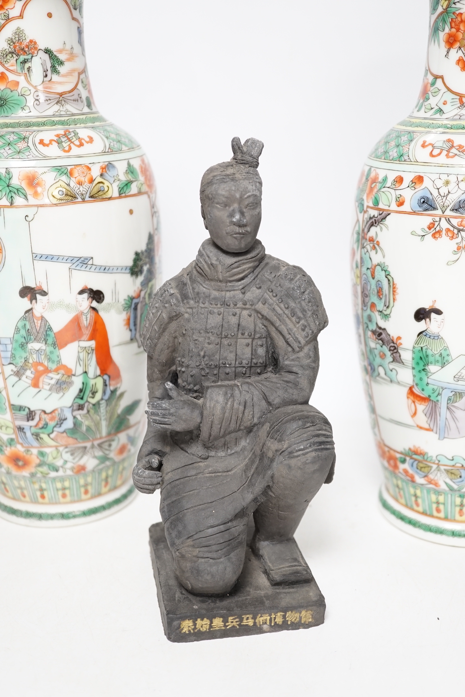 A pair of 20th century Chinese famille verte vases and a figure, tallest 31cm